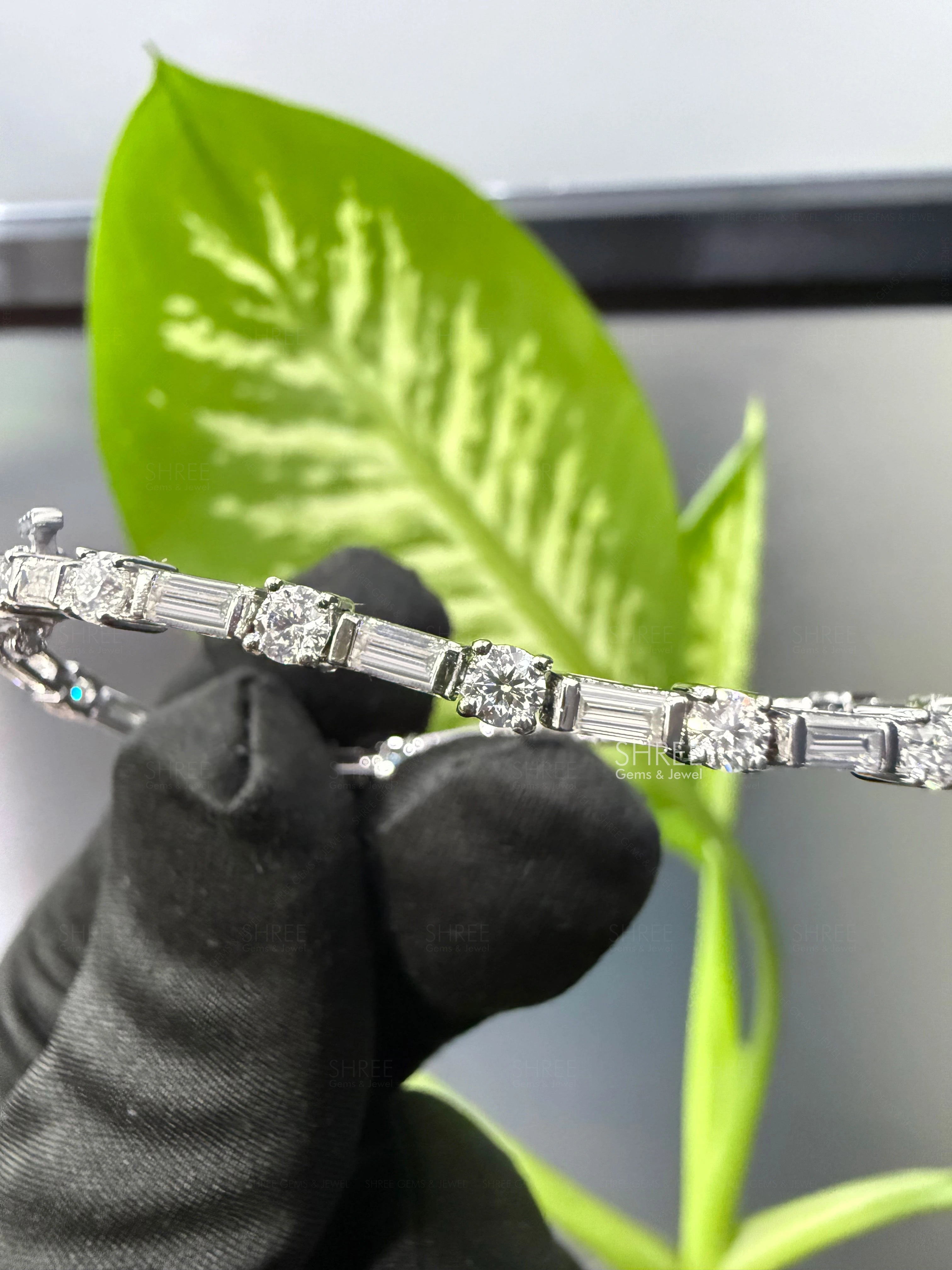 front view of baguette and round diamond tennis bracelet