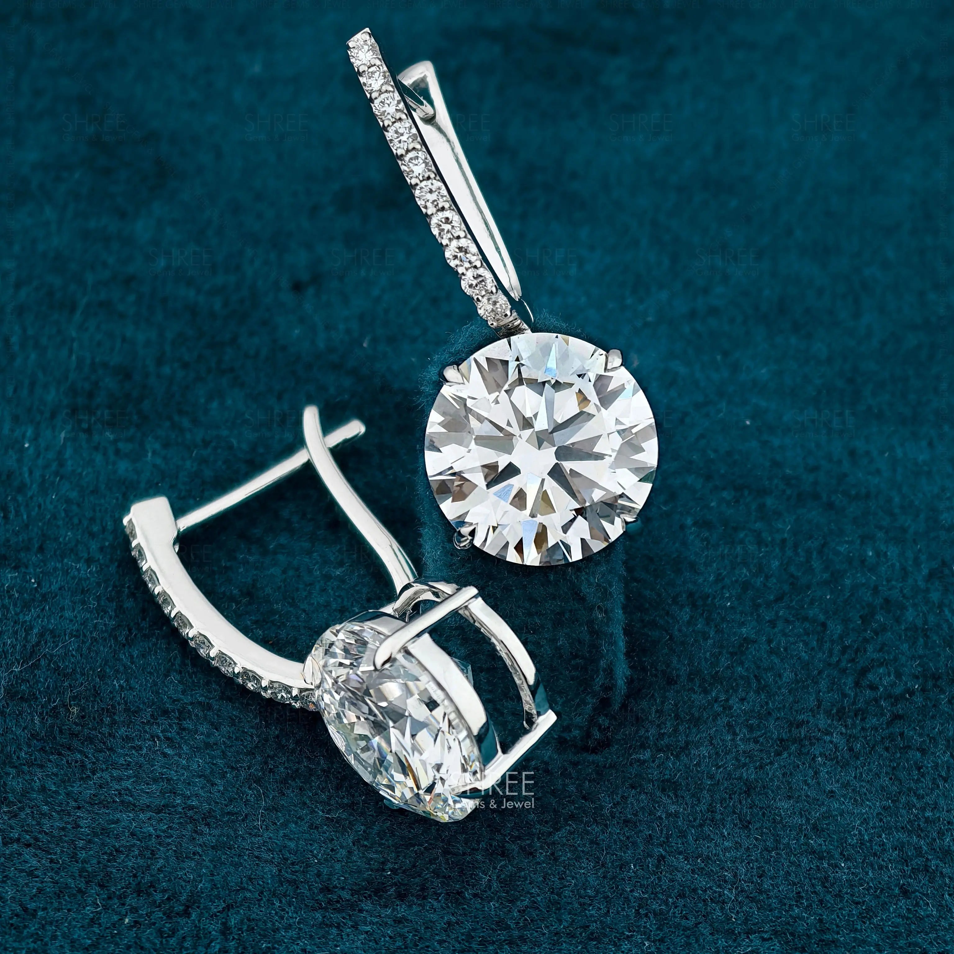 front and side view of womens diamond drop earrings​
