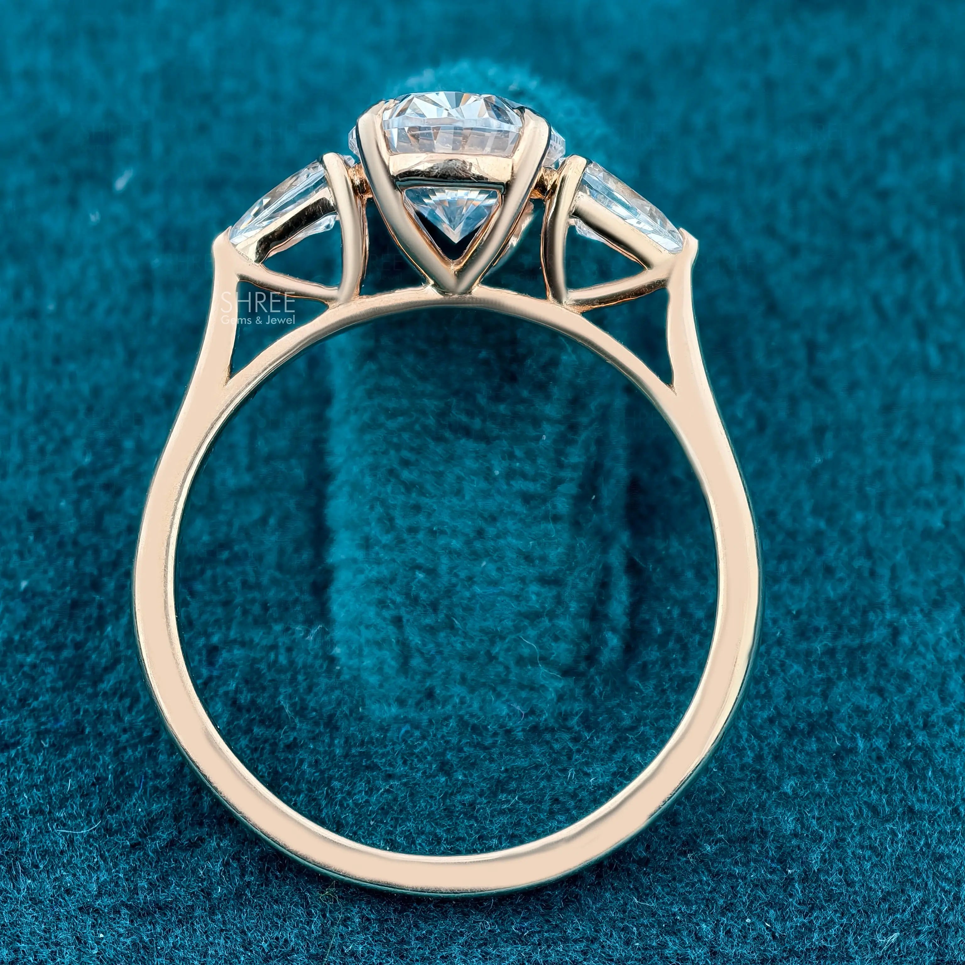 Side Profile of Oval and Pear Three Stone Lab Grown Diamond Ring