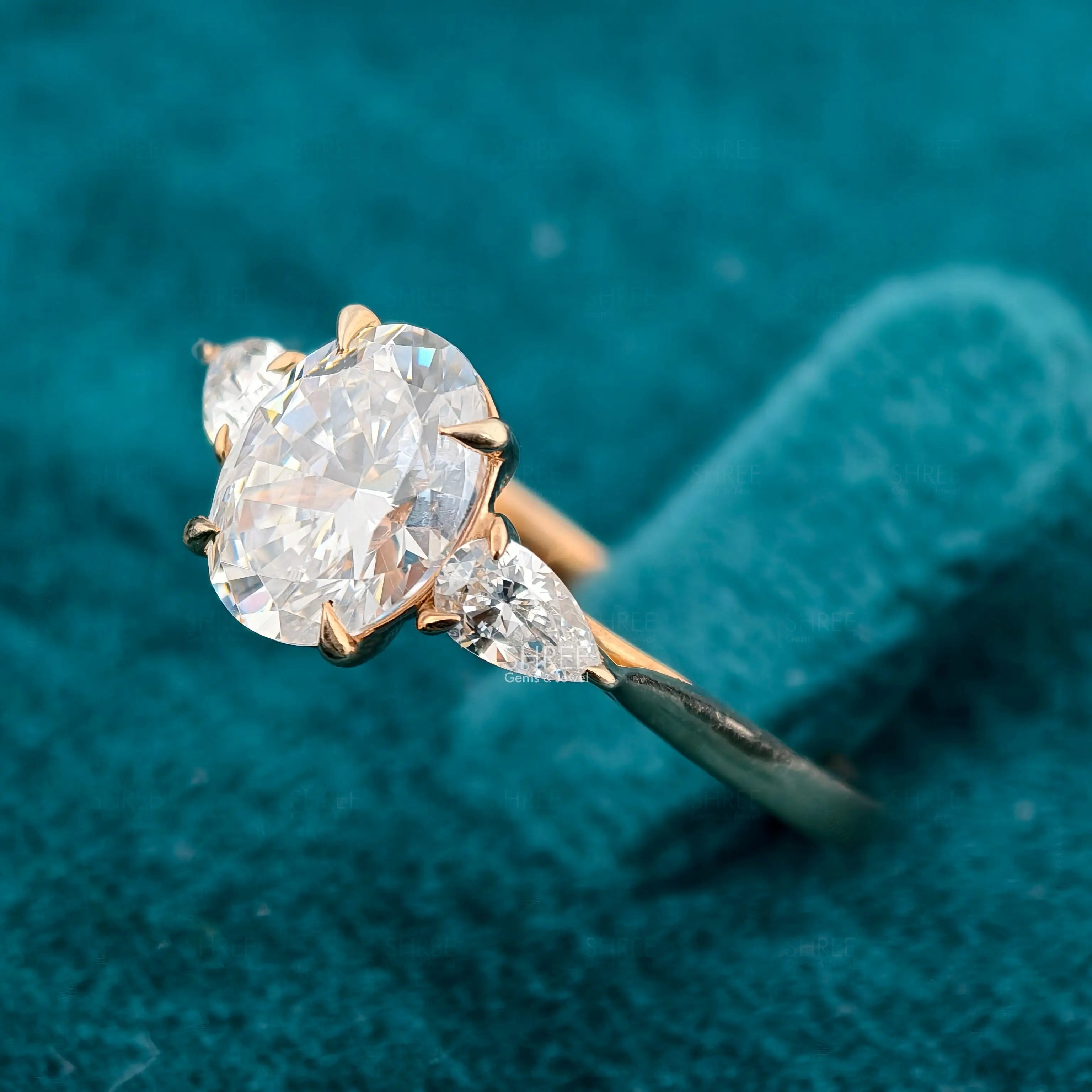 Side Angle View of 1 Carat Oval & Pear Three Stone Lab Diamond Ring