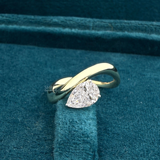 Front view of 1 ct pear shape bypass diamond ring​