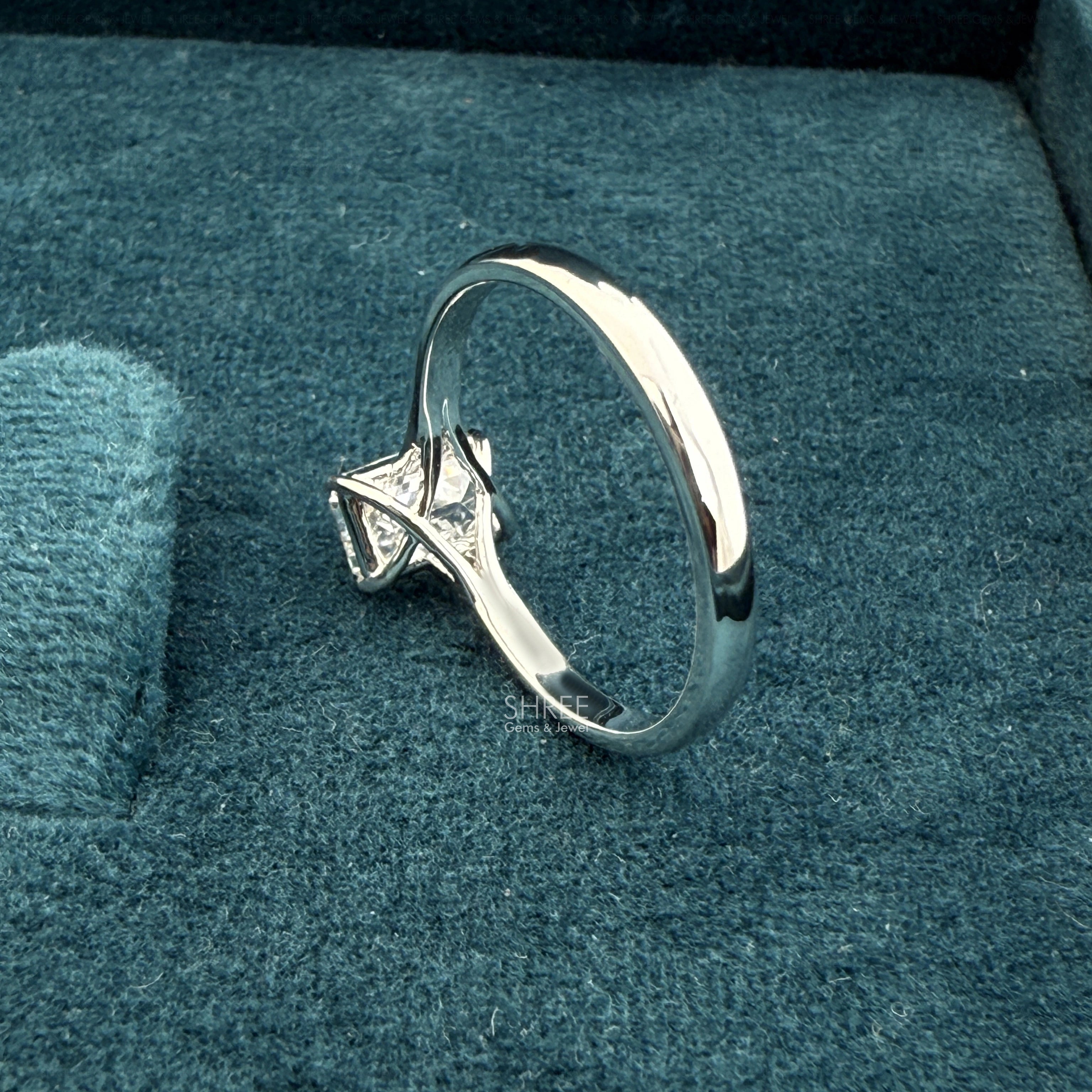 back metal view of 1 ct solitaire unique emerald cut diamond rings
