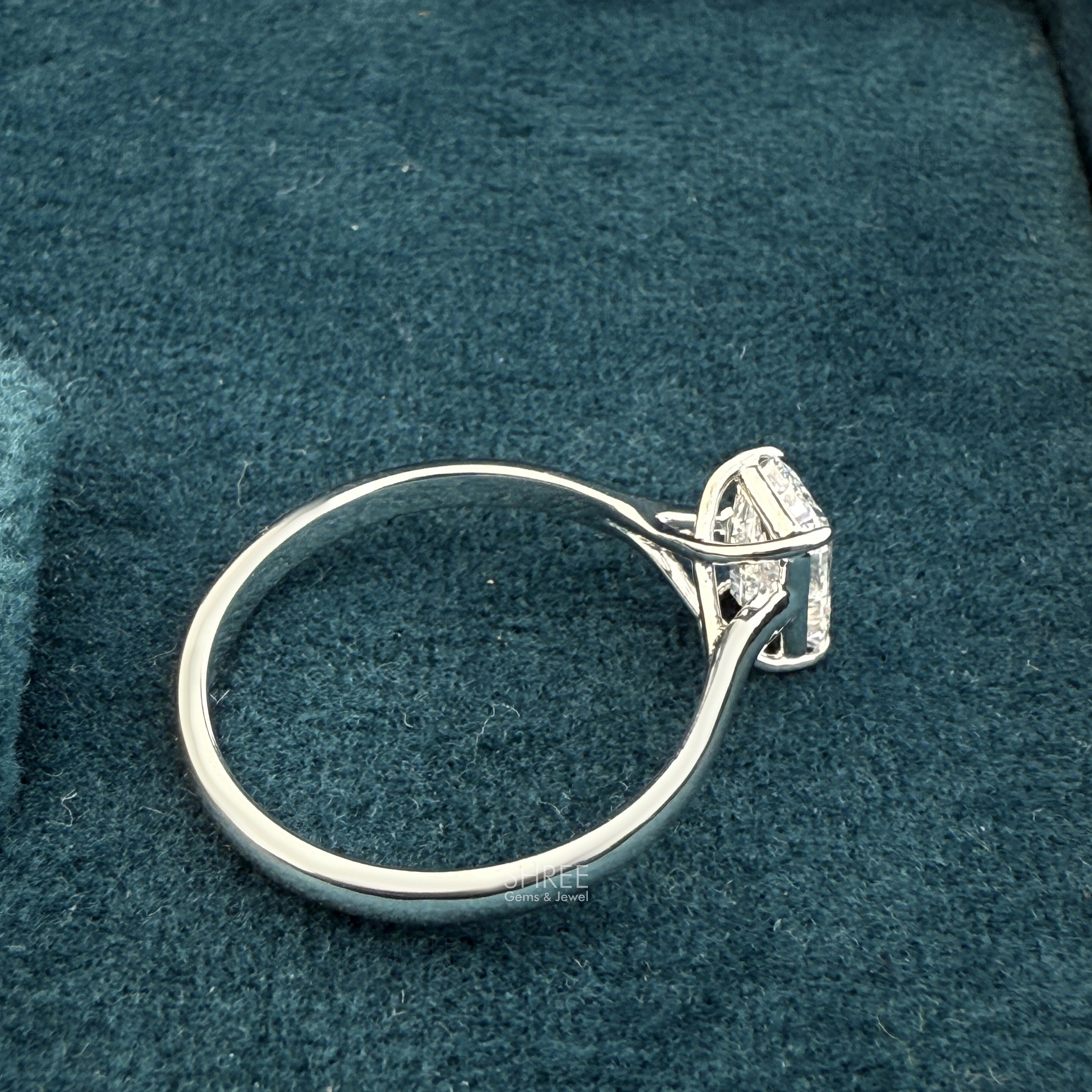 Side view of 1 ct emerald cut solitaire diamond rings for women​