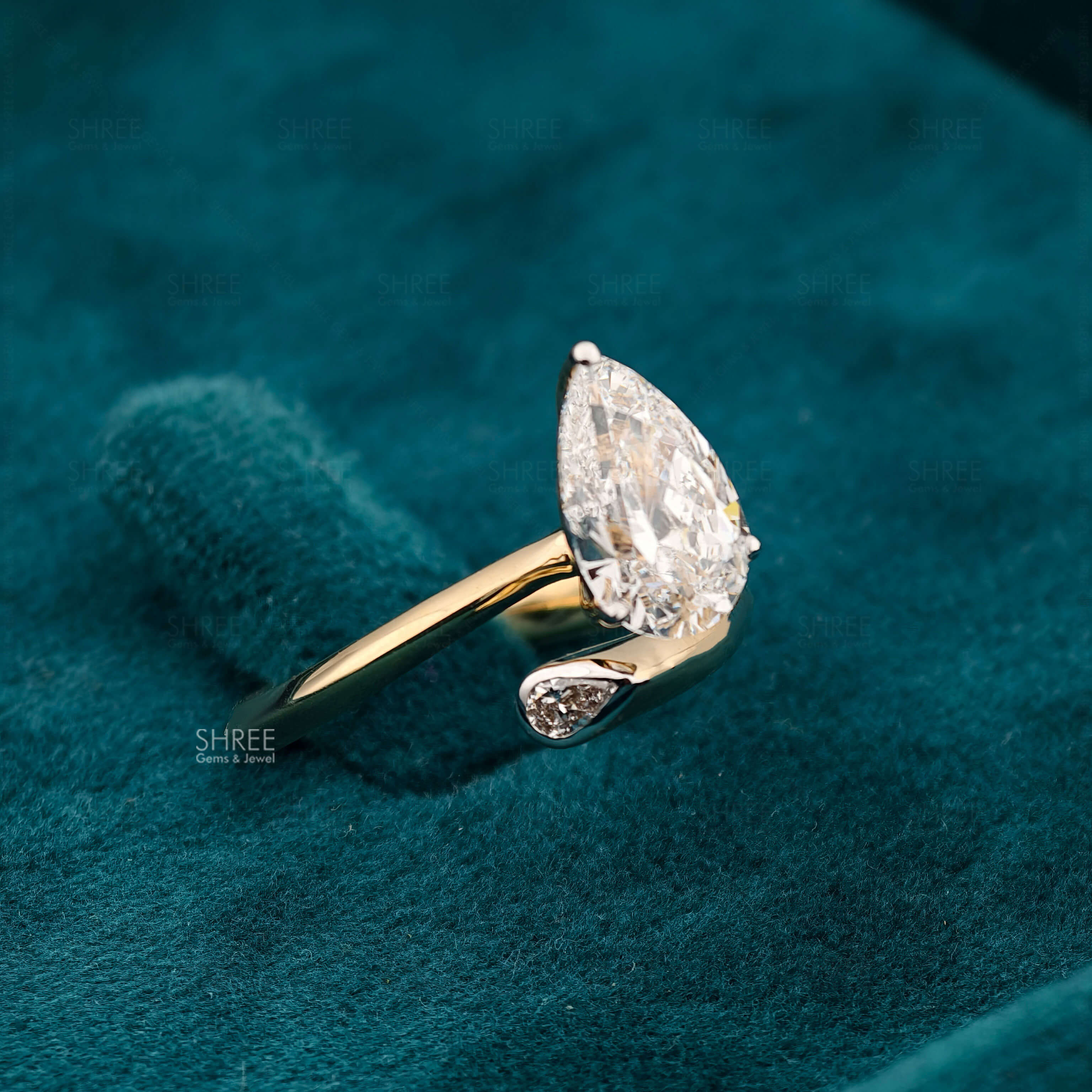 Side Diamond Front View Of 2 Carat Pear Shaped Lab Diamond Bypass Ring
