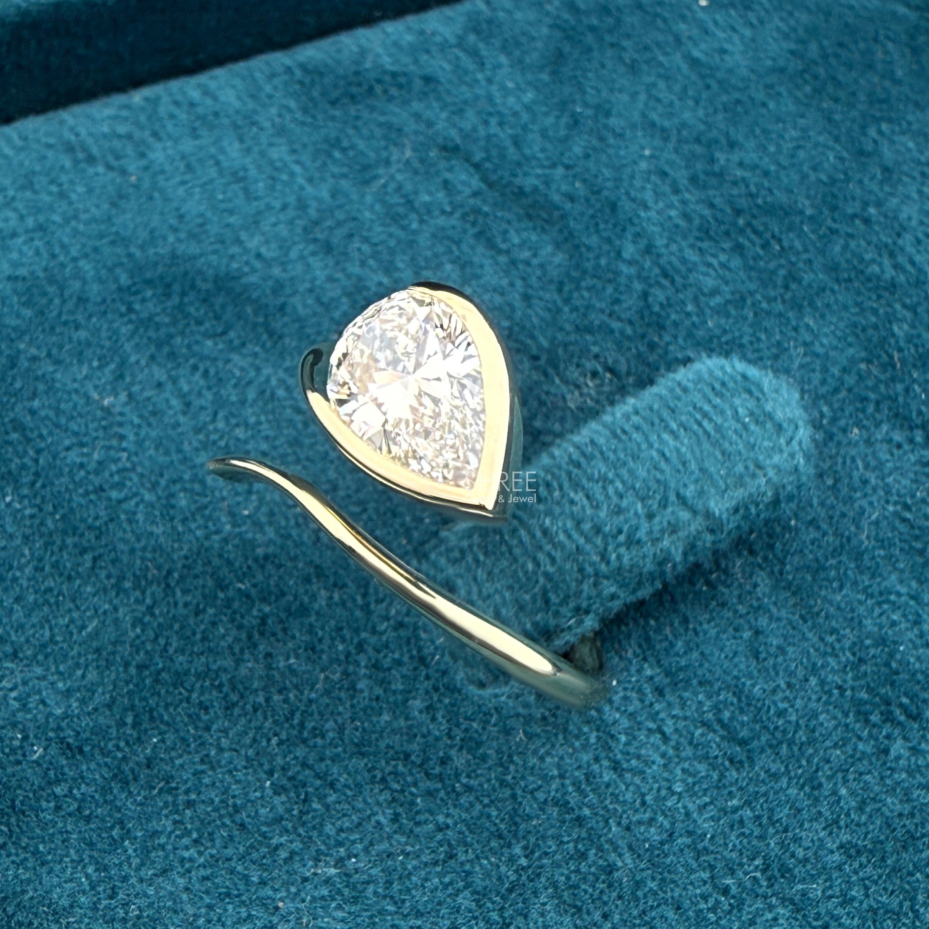 side view of solitaire 2 carat pear diamond ring​
