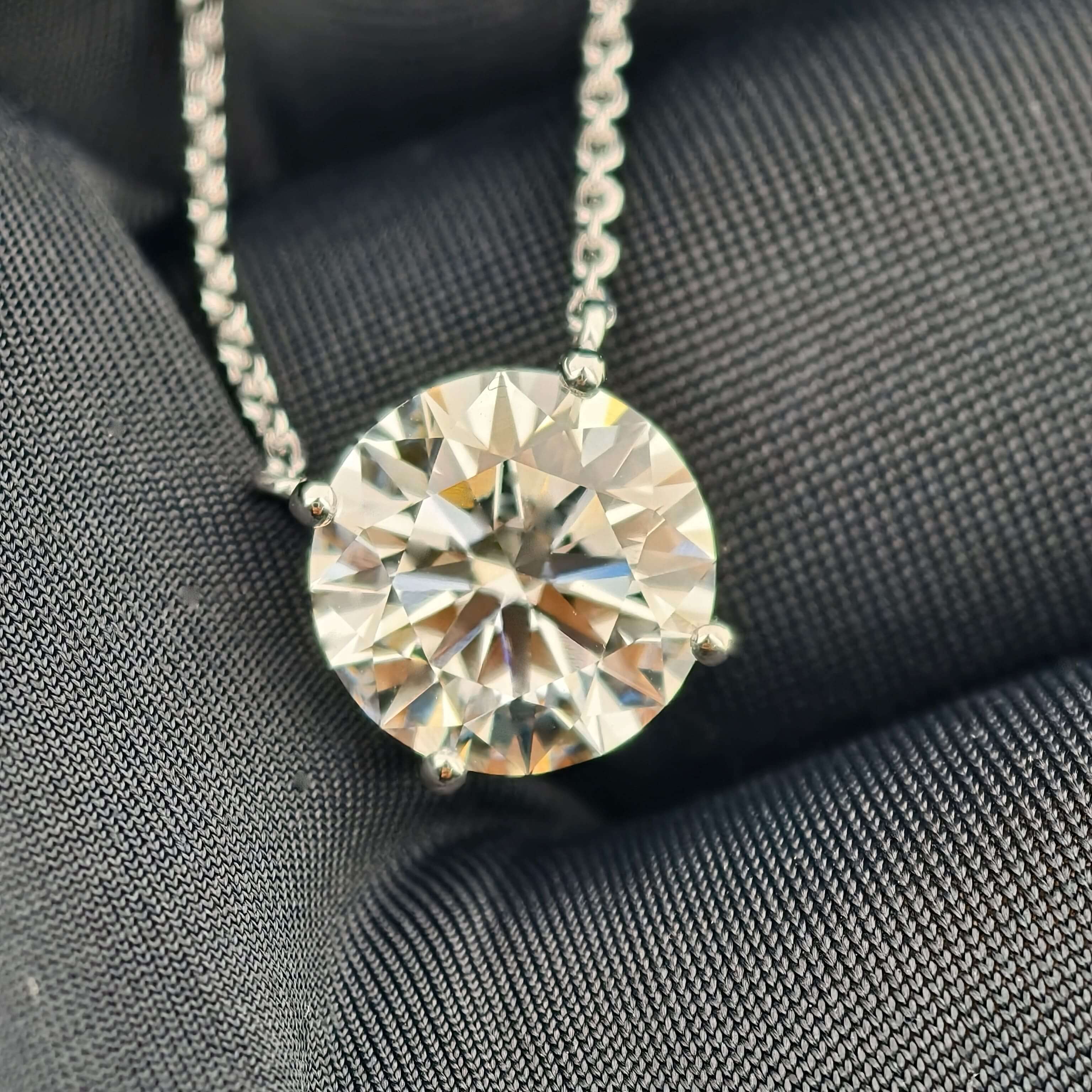 in hand view of 2 carat lab grown diamond necklace