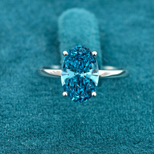 Front view of 3 Carat Fancy Blue Oval Hidden Halo Engagement Ring