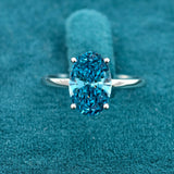 Front view of 3 Carat Fancy Blue Oval Hidden Halo Engagement Ring