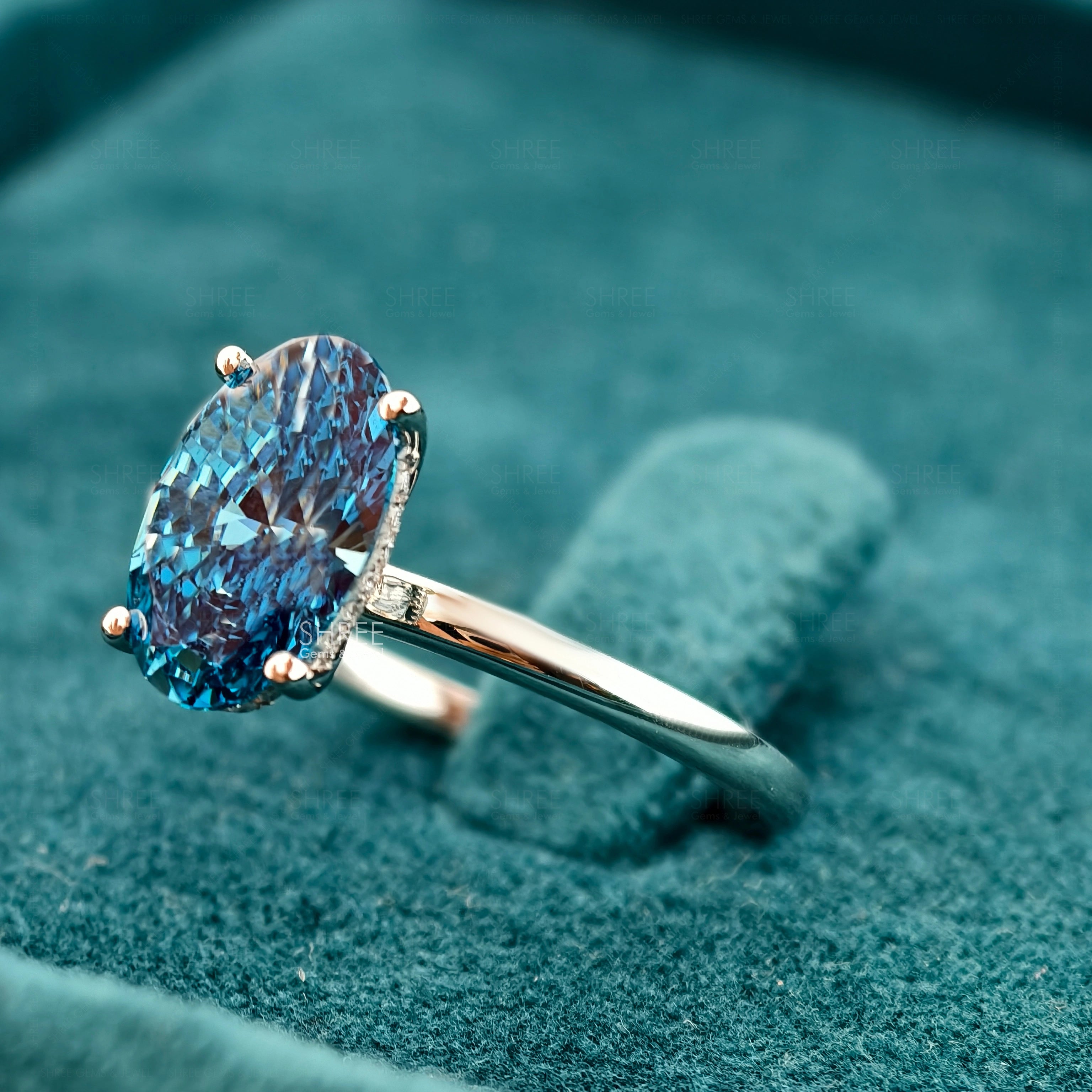 Side view of 3 Carat Fancy Blue Oval Hidden Halo Engagement Ring