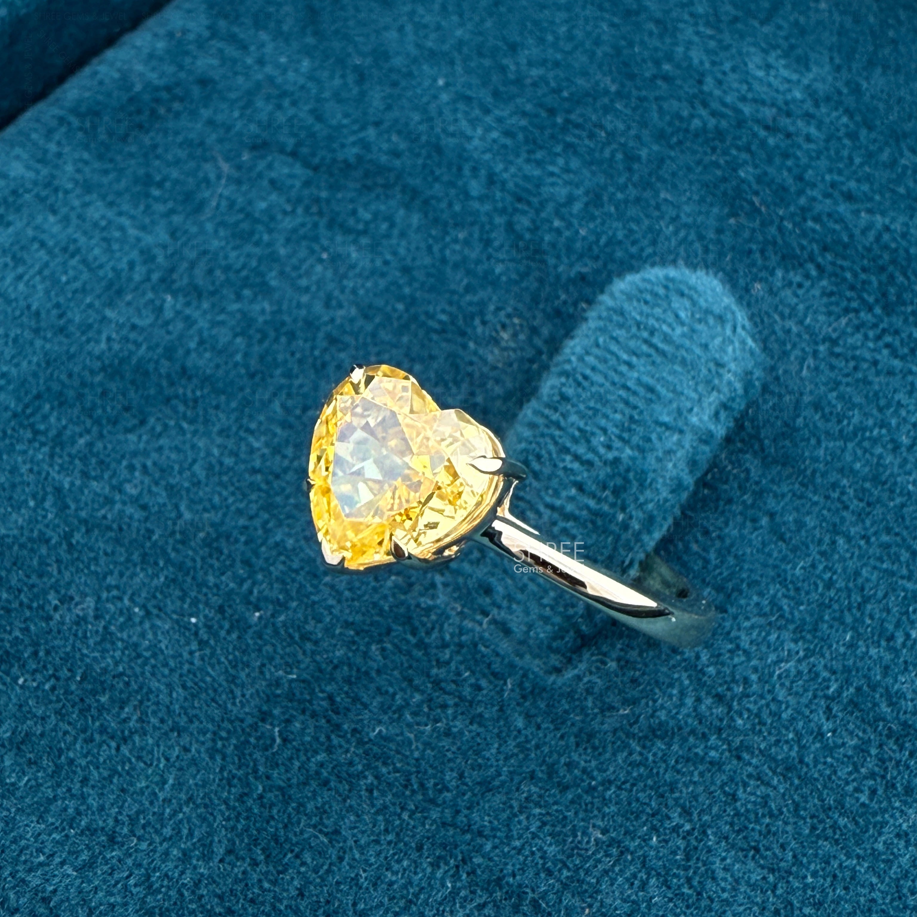 side view of lab grown heart shaped diamond ring
