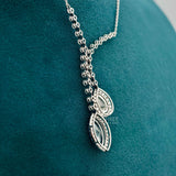 backside view of teardrop diamond necklace​