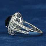 side view of salt and pepper oval diamond ring​