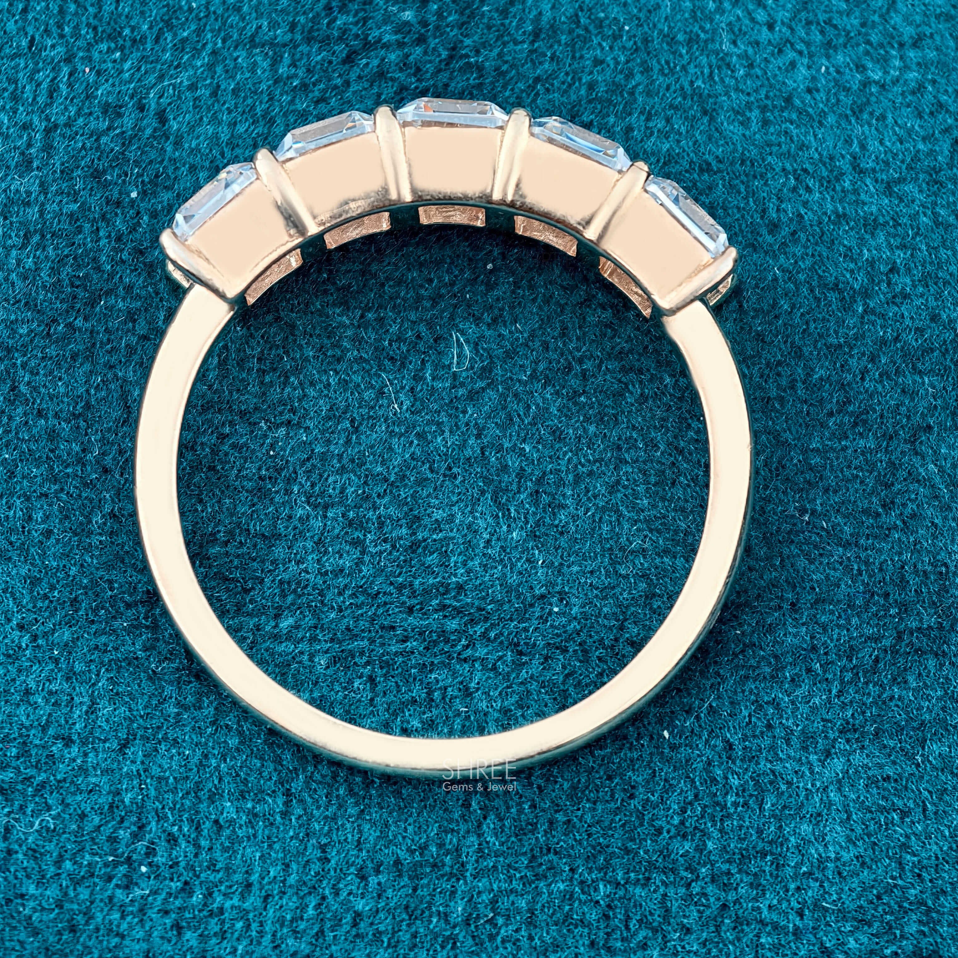 Close up vertical view of 5 Stone Emerald Cut Diamond Eternity Band​