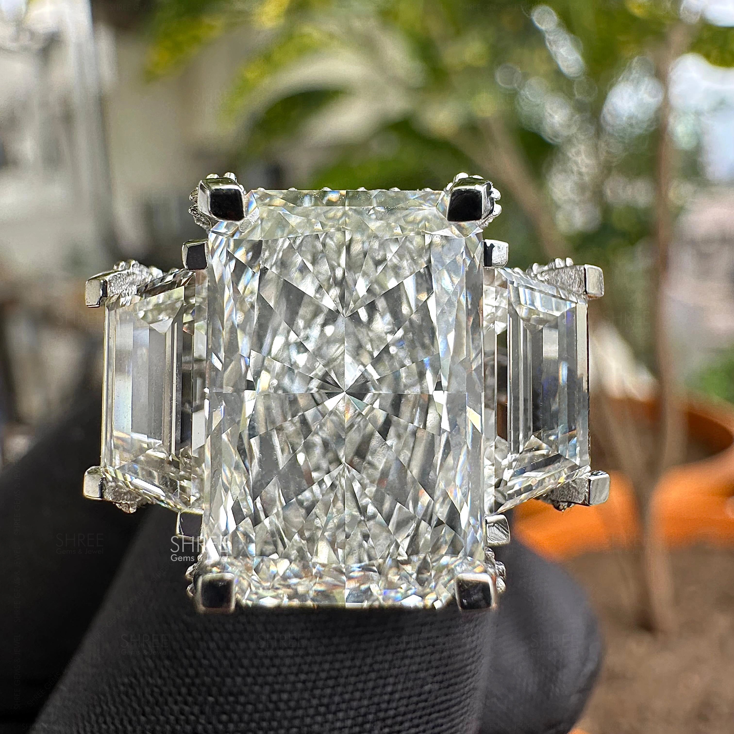 Front view of 7 Carat Radiant Three Stone Halo Engagement Ring