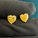 Close up Of 4 Ct Heart Cut Yellow Lab Grown Diamond Earrings