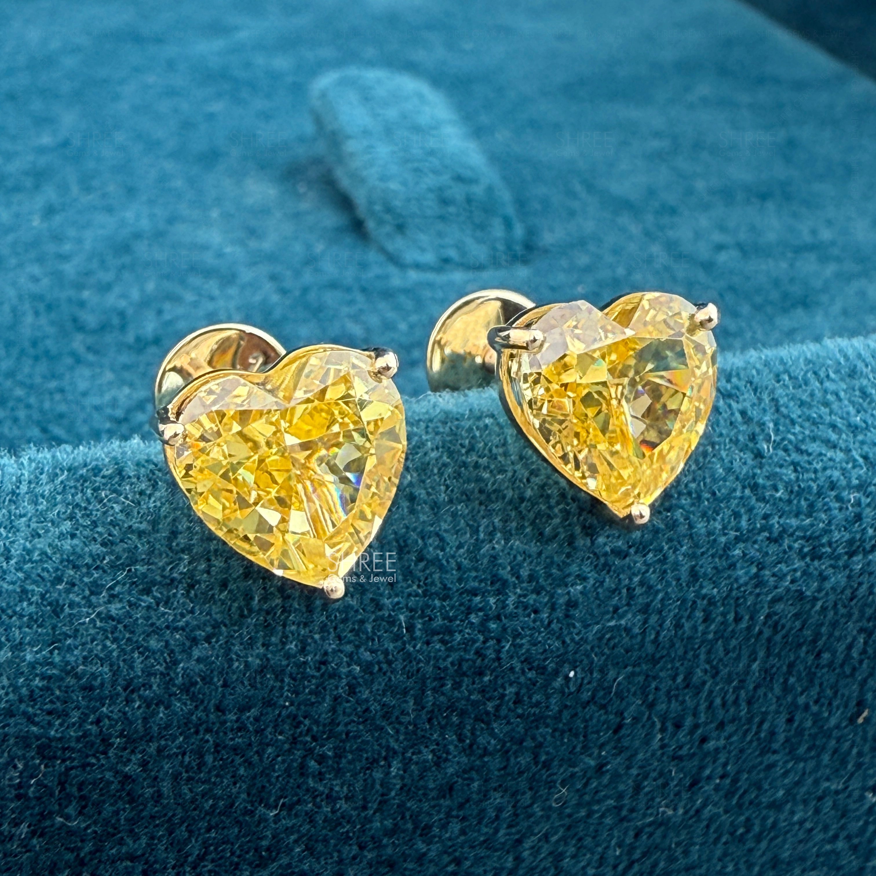 Close up Of Heart Cut Yellow Lab Grown Diamond Earrings