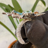 side view of diamond butterfly engagement ring​
