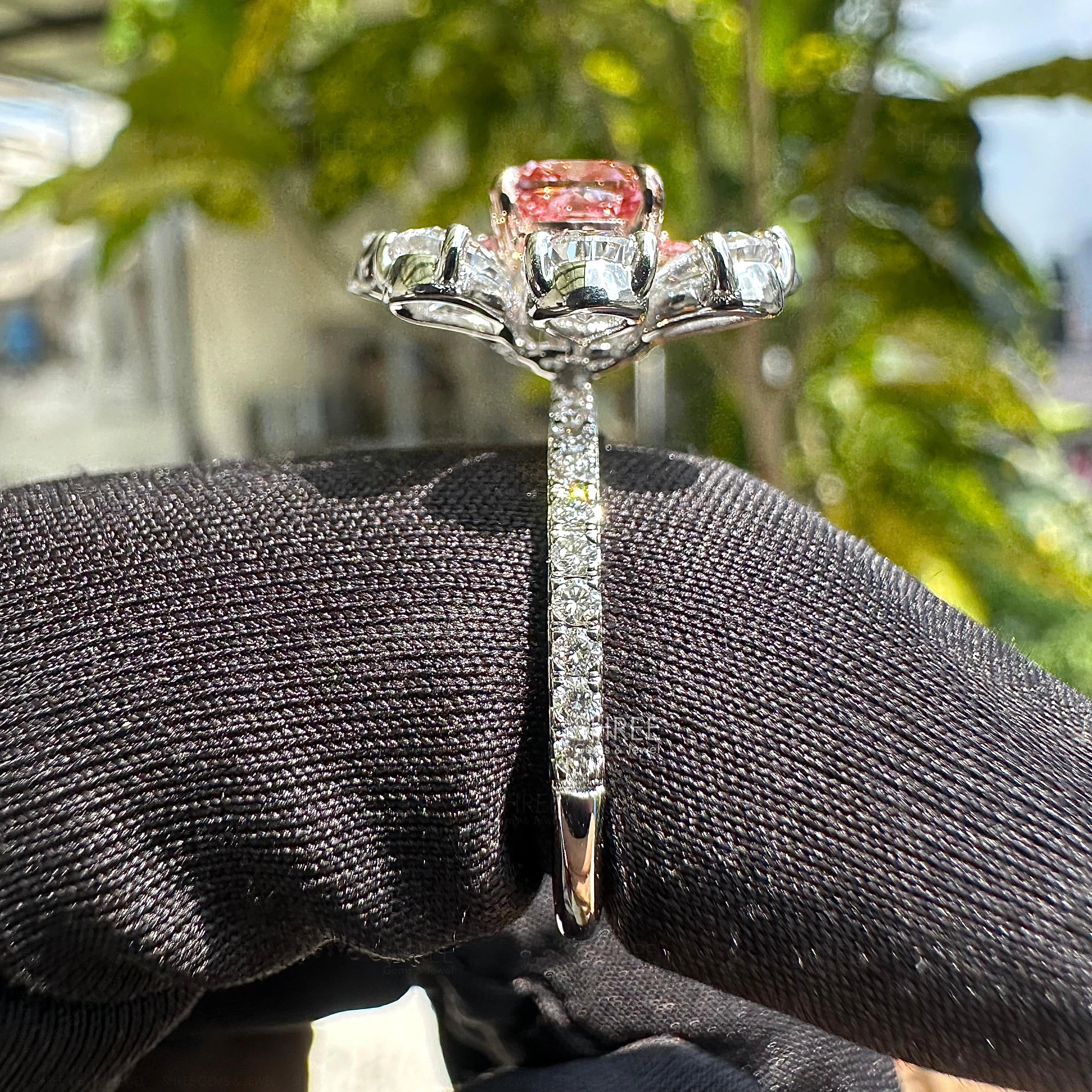 side view of pink diamond engagement ring​

