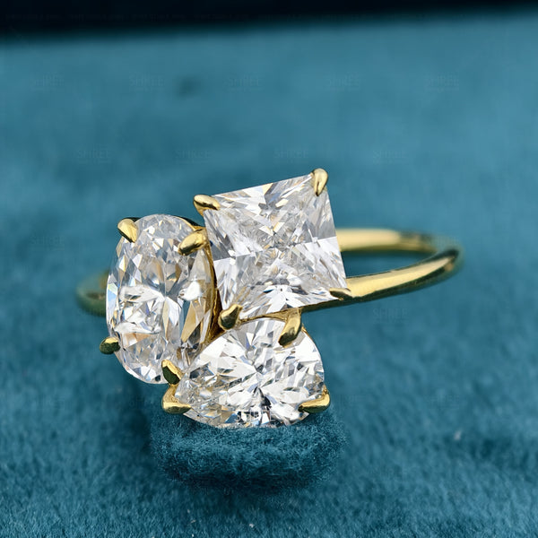 Front view of Princess, Oval and Pear Cut Three Stone Toi Et Moi Ring​