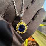 blue sapphire pendant​ in hand view
