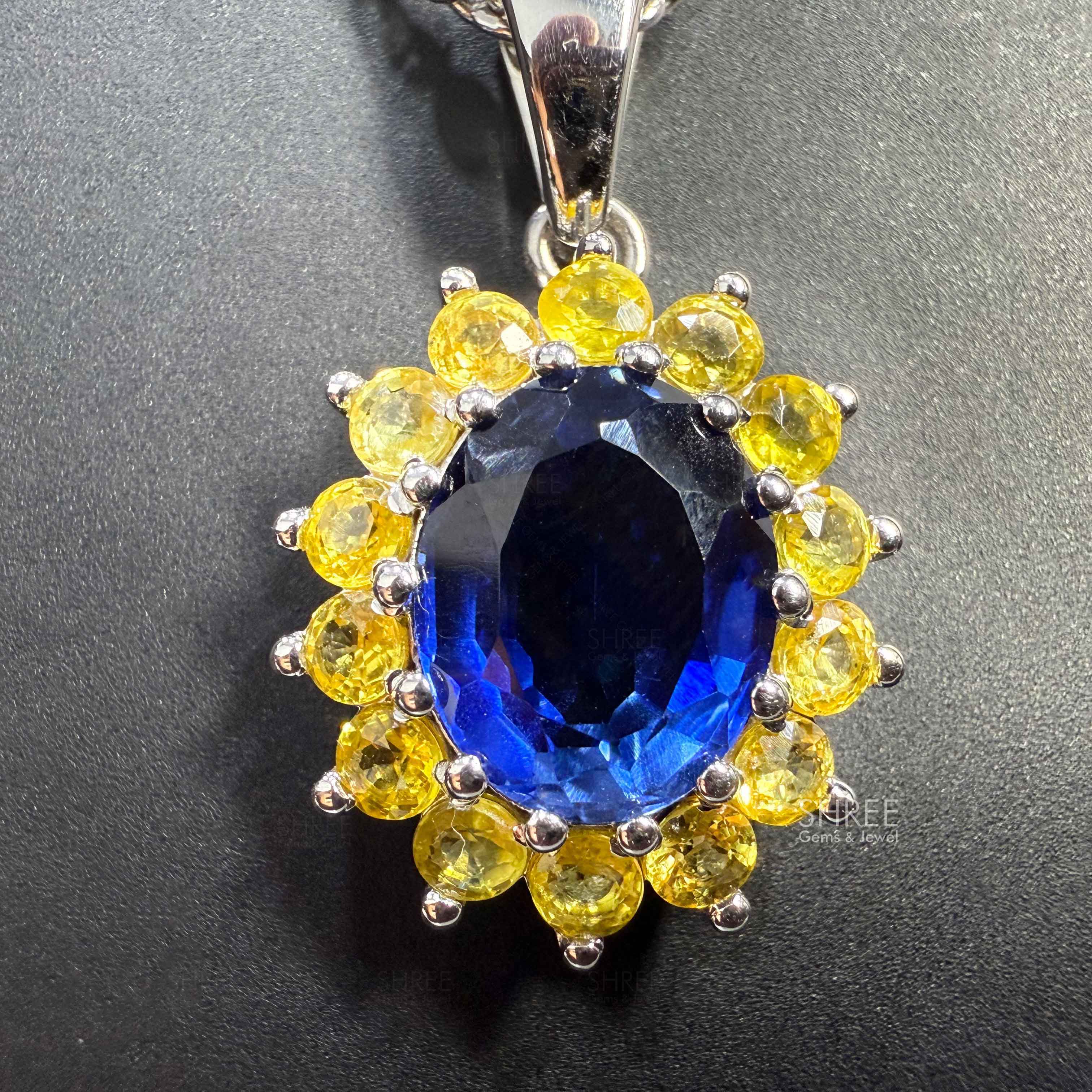front view of Halo Design Sapphire and Diamond Pendant​