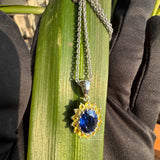 pendant with gemstones in hand view 