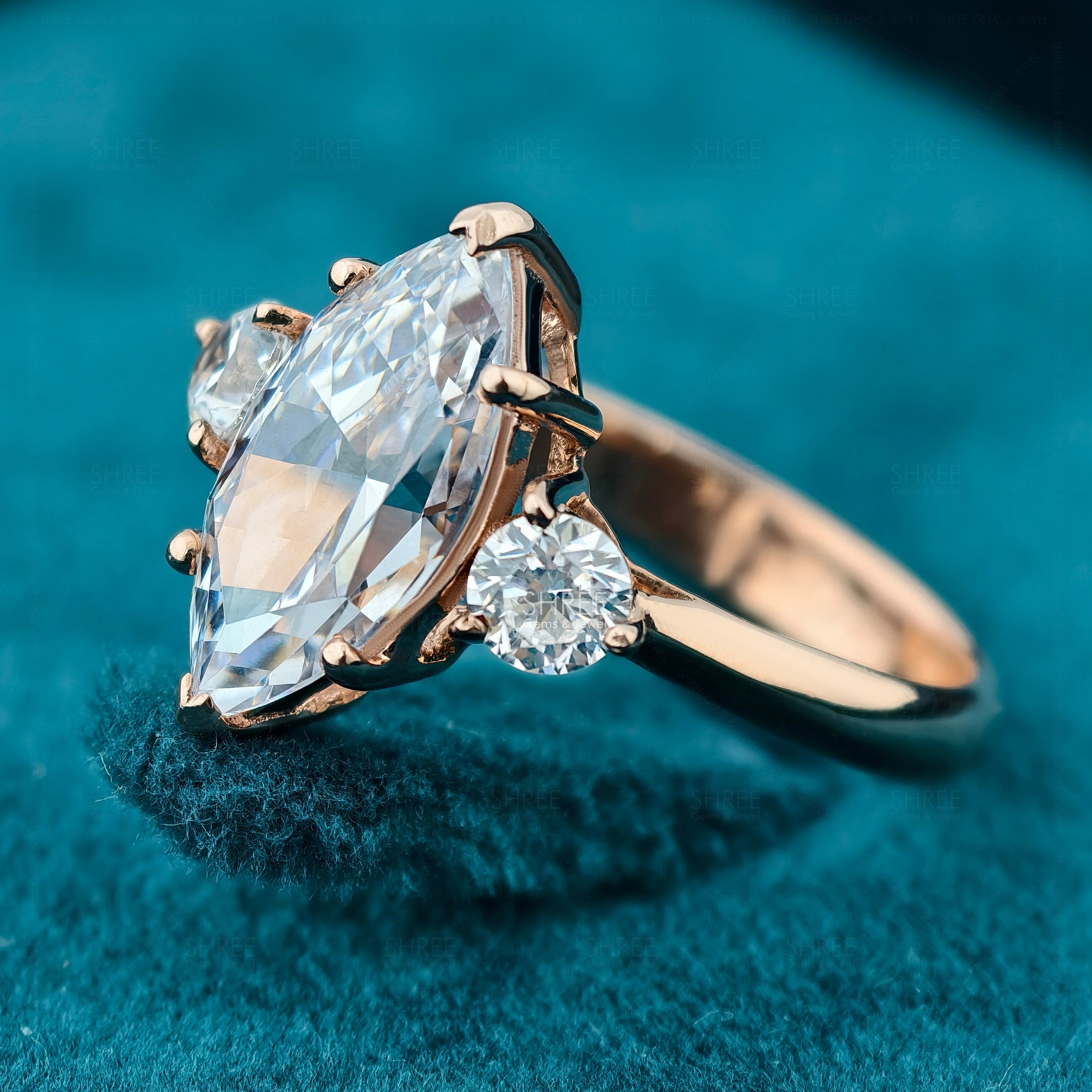 Side view of Marquise Cut Three Stone Engagement Ring​