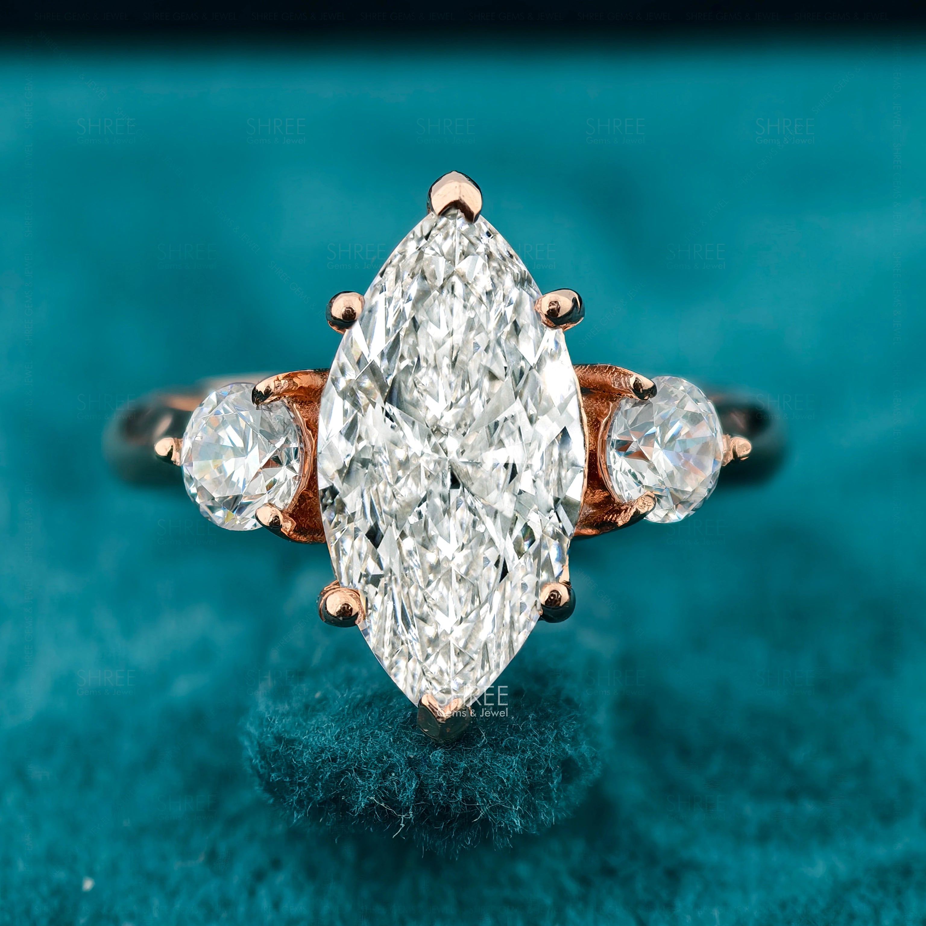Front view of Marquise Cut Three Stone Engagement Ring​
