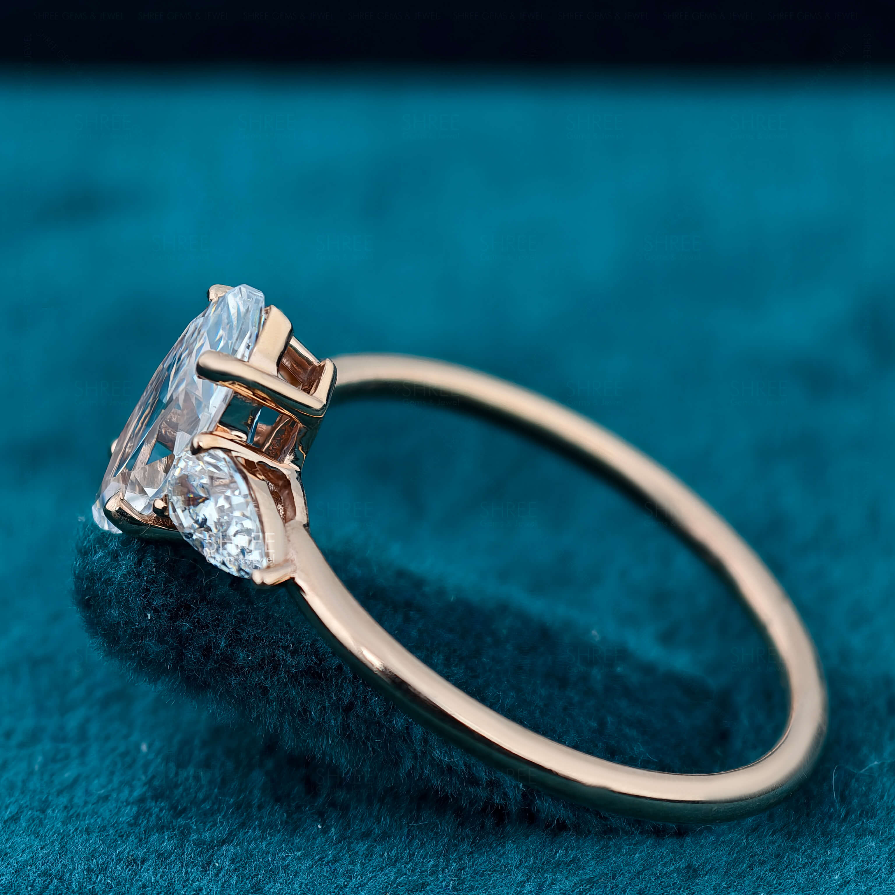 Side View of Marquise & Pear Cut Three Stone Lab Created Diamond Ring​