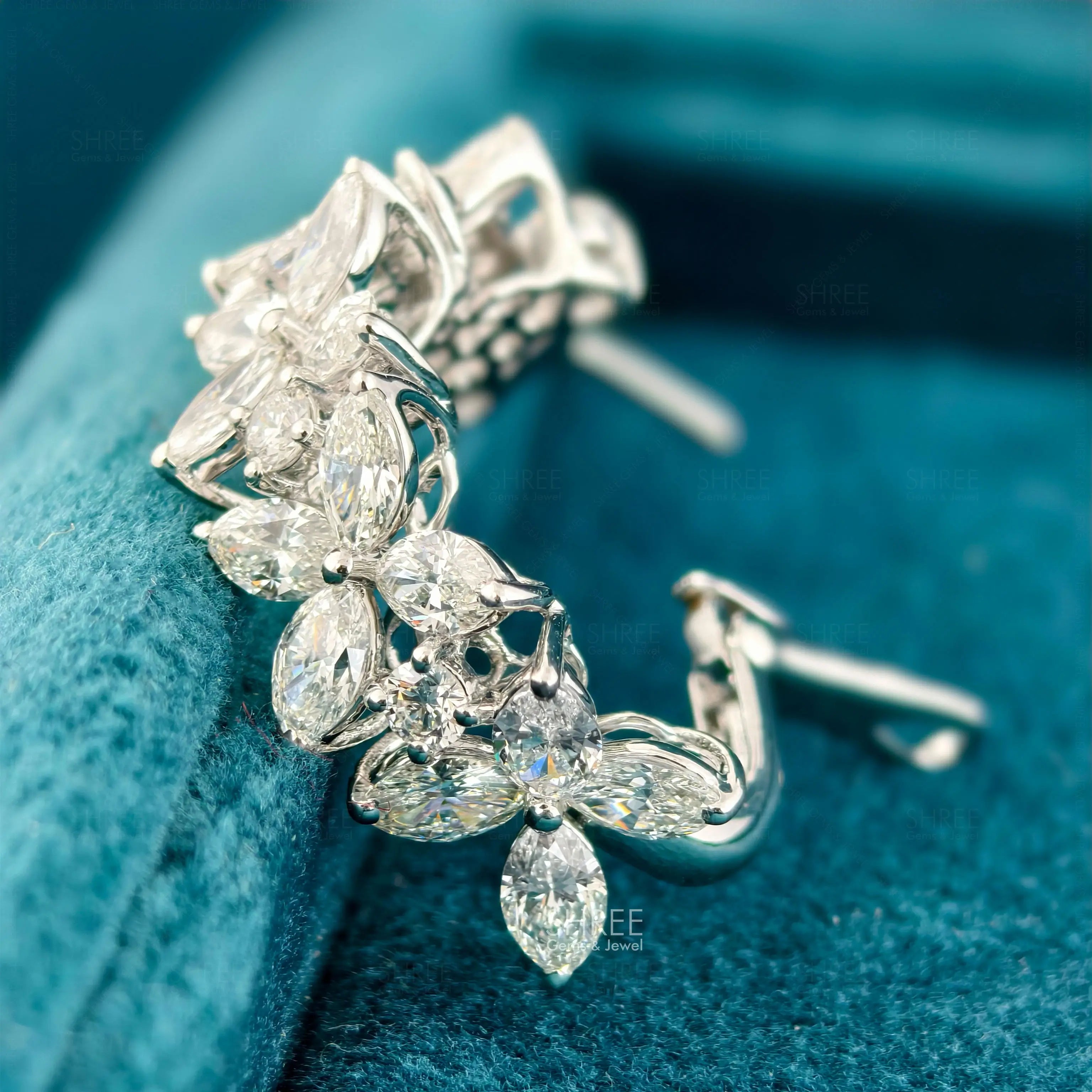 side view of diamond dangling earrings
