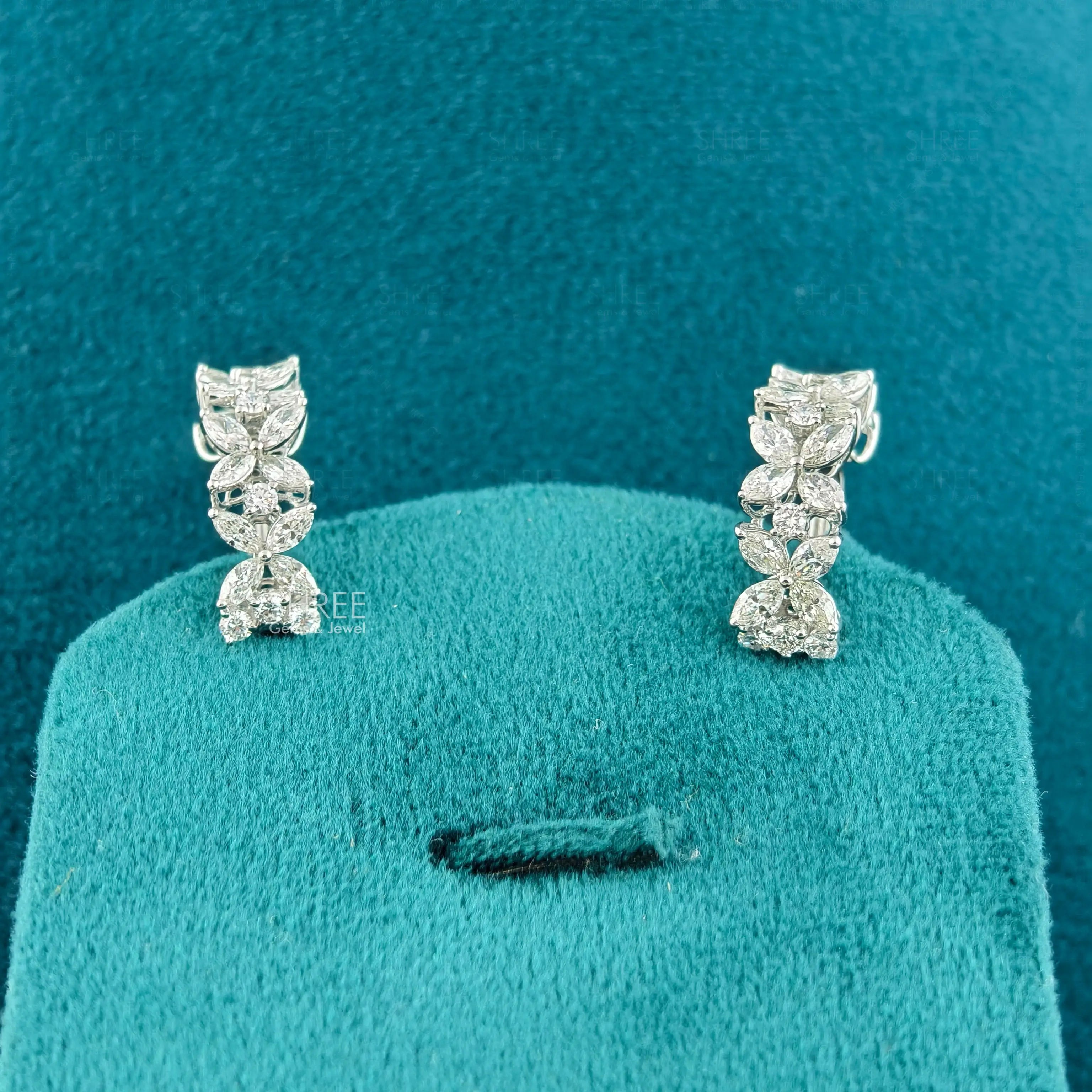 front view of diamond dangle diamond earrings​
