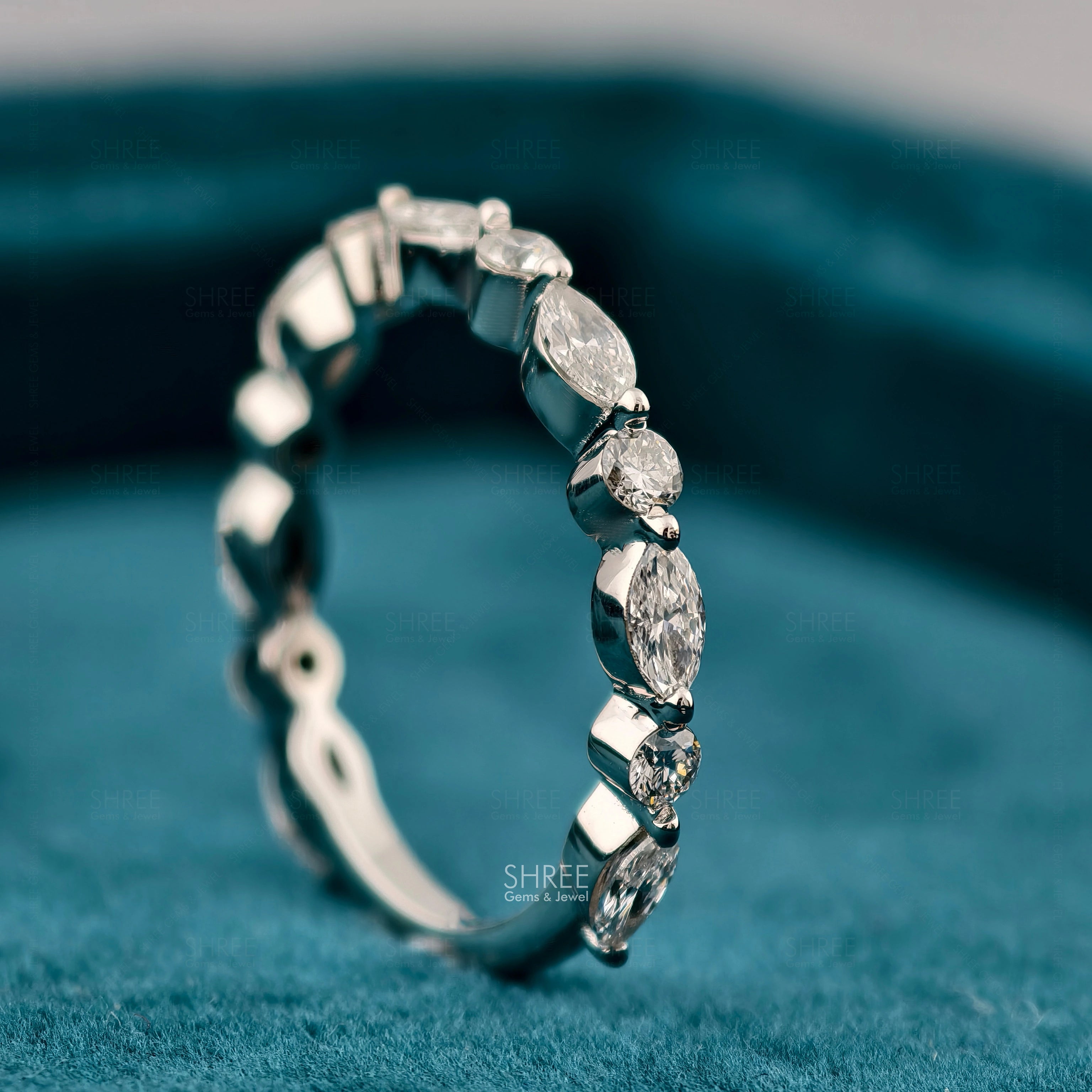 Close up view of Marquise and Round Diamond Eternity Ring​