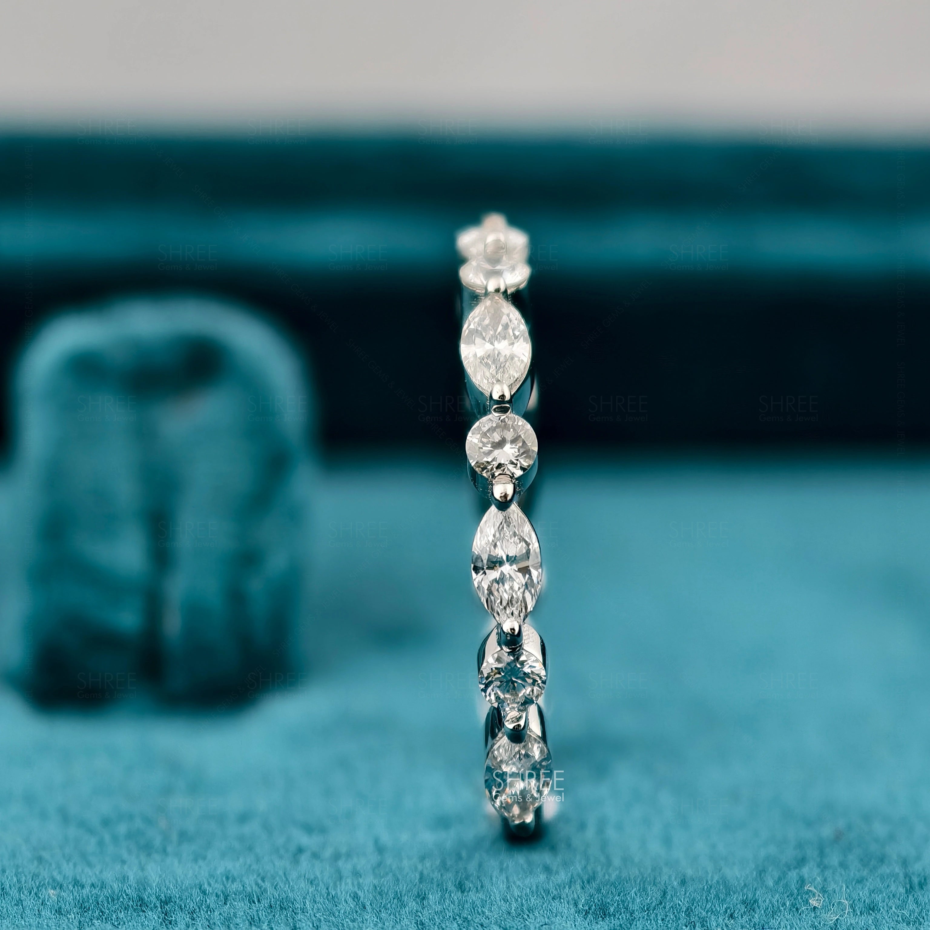 Side view of Marquise and Round Diamond Eternity Ring​