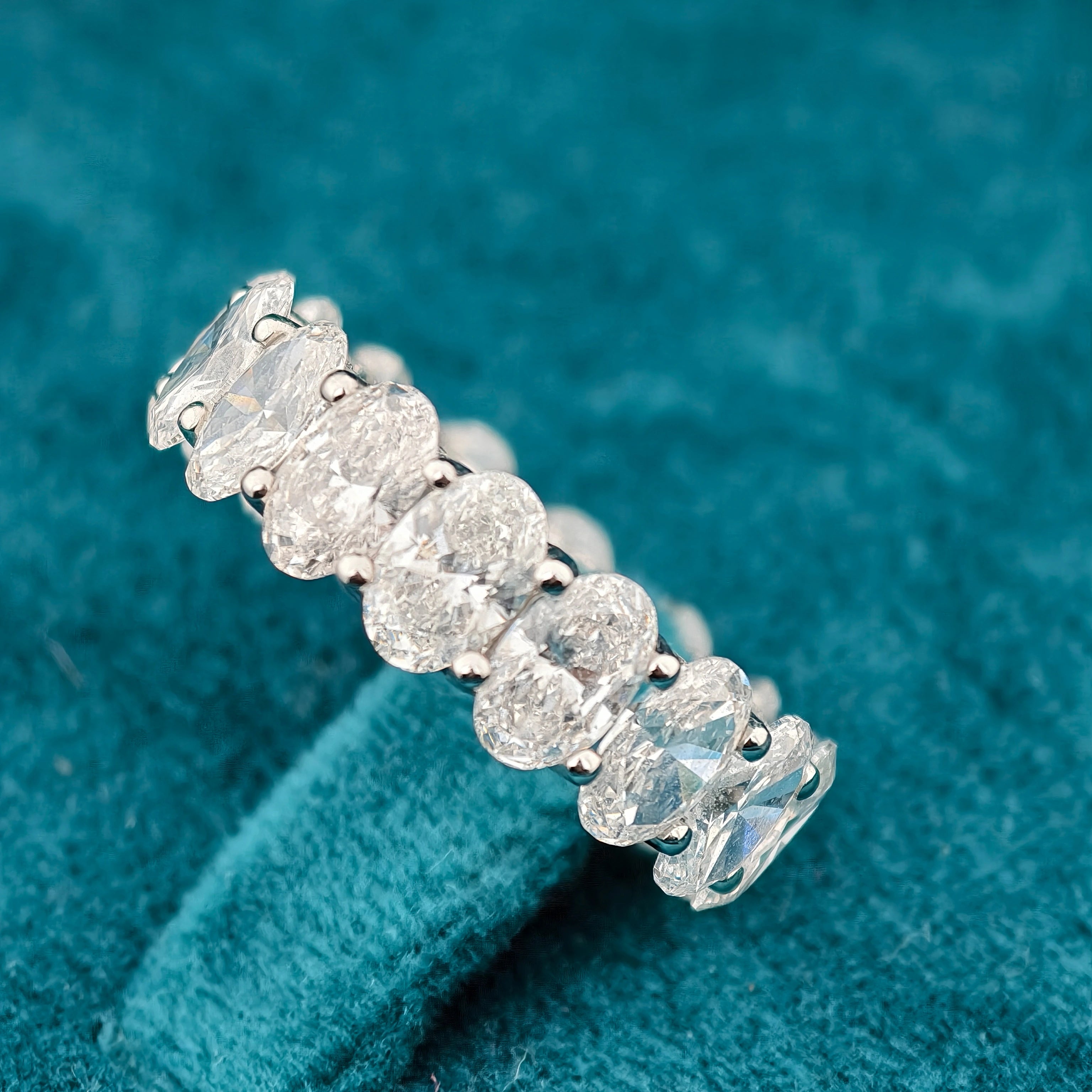 side view of oval cut lab created diamond wedding bands