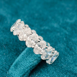 side view of oval cut lab created diamond wedding bands