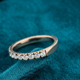 Side view of round half diamond eternity band​
