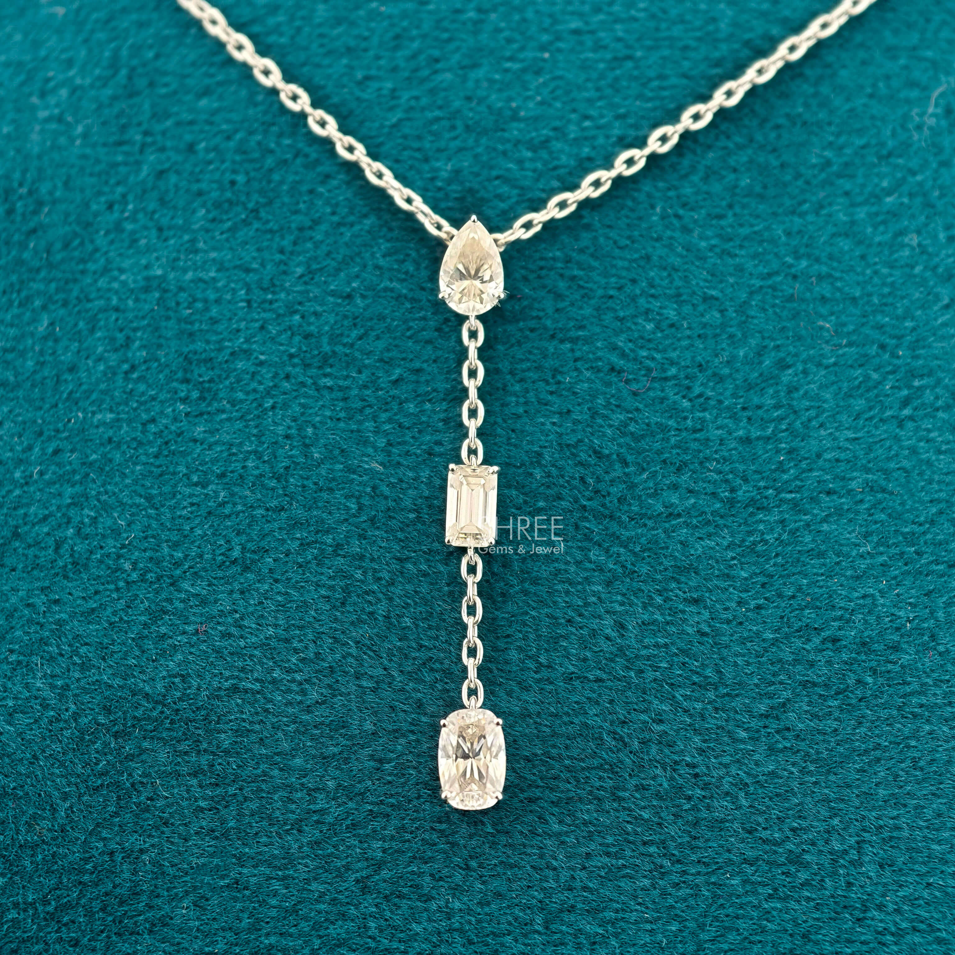 front view of diamond necklace three stone​