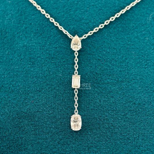 front view of diamond necklace three stone​
