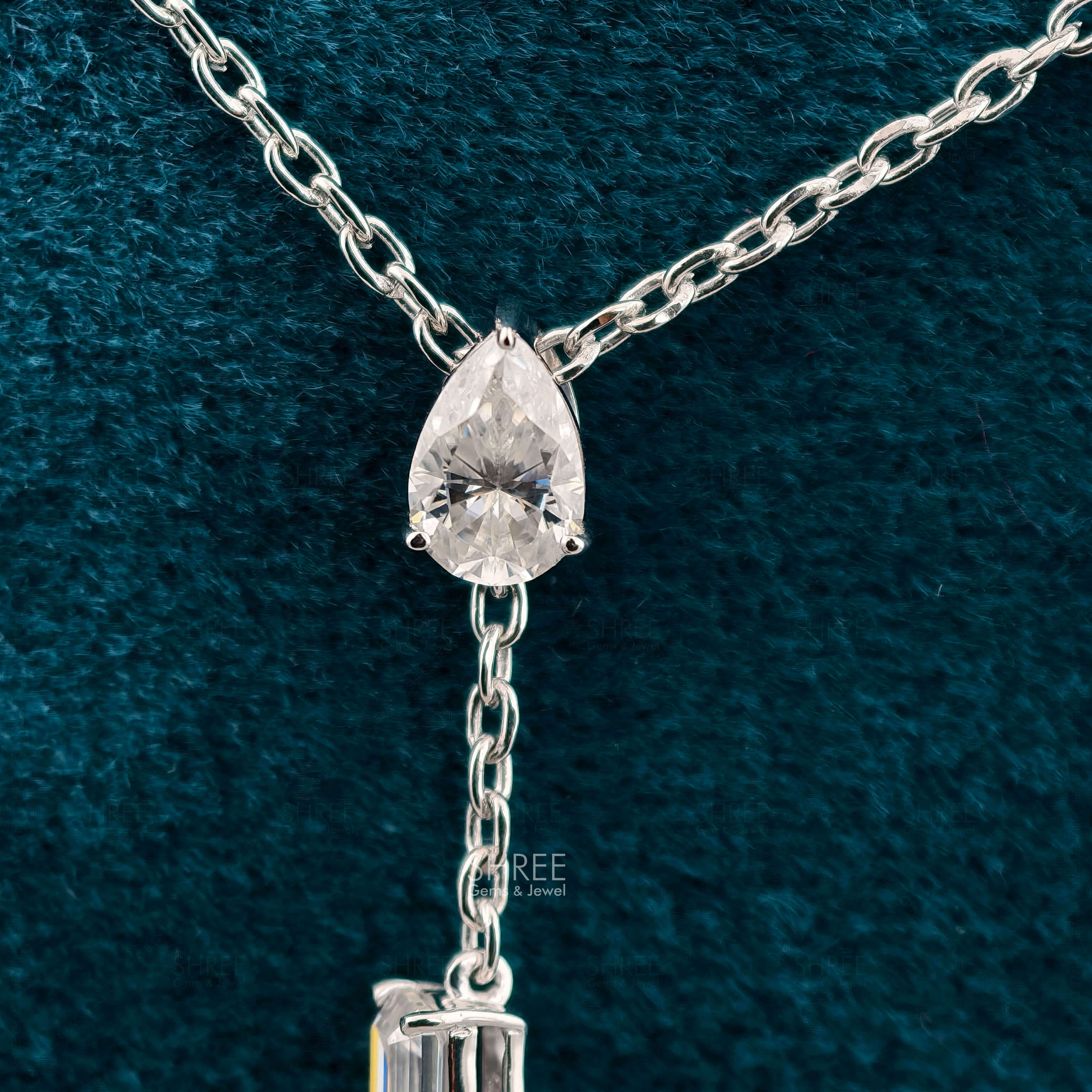 front view of three stone diamond pendant necklace​